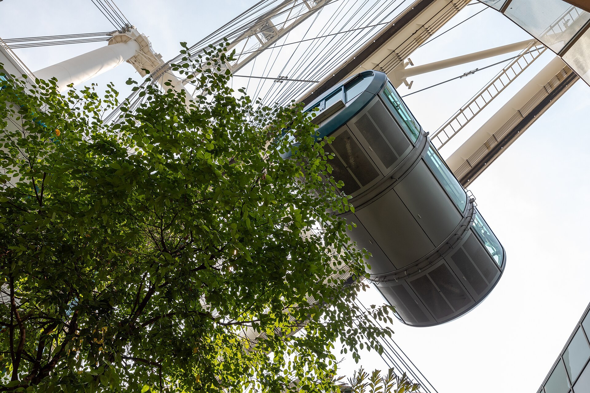 A Singapore Flyer capsule seen from below against the wheel structure